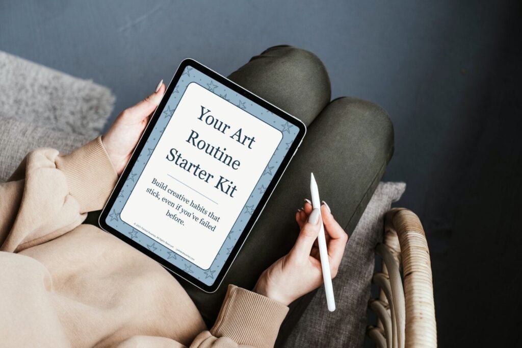 Woman using iPad with art routine freebie by Painted Reveries displayed on screen